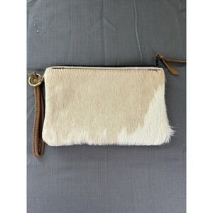 Cowhide flat wristlet tan and white. Brown strap 9x6x.5